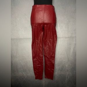 Crimson red high-waist faux-leather leggings with zipper ankle detailing
